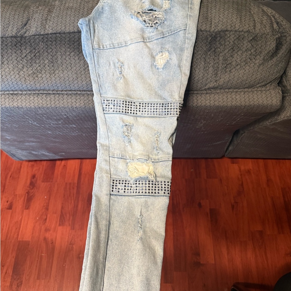 Distressed Light Blue Jeans with Studded Accent